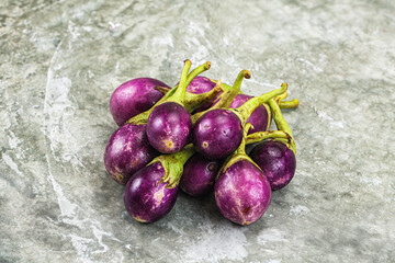 Small organic young purple round eggplant