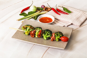 Thai Street foof satay with bacon and broccoli