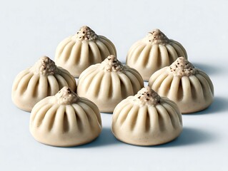 Obraz premium Seven Delicious Khinkali Dumplings Artfully Arranged on a Soft Blue Background