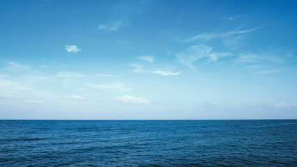 Calm blue ocean sea waves in sunny day. Tropical seascape horizon. Nature background.