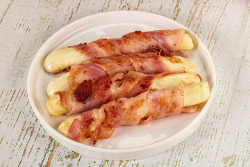 Hot mozzarella sticks with bacon