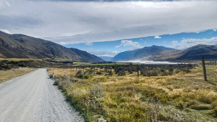 Surrounded by mountain ranges the extreme arid dry farming fields in the Rangitata Valley  in...