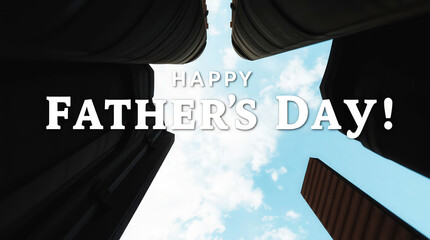 Low angle shot of a Father's Day message on a cloudy sky background with skyscrapers close up detail