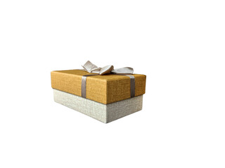 Elegant gift box with golden top and beige bottom tied with silver ribbon bow isolated on transprent background.
