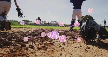 Female baseball team practicing on infield dirt, showing pink network overlay for sports analytics - Powered by Adobe