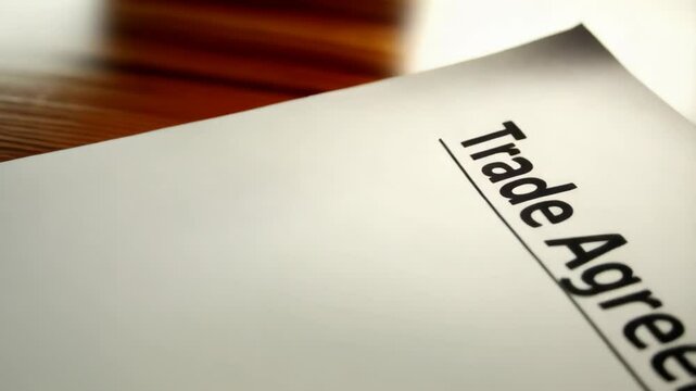 Close-up of a Trade Agreement document symbolizing US-China trade relations and tariffs. Economic warning