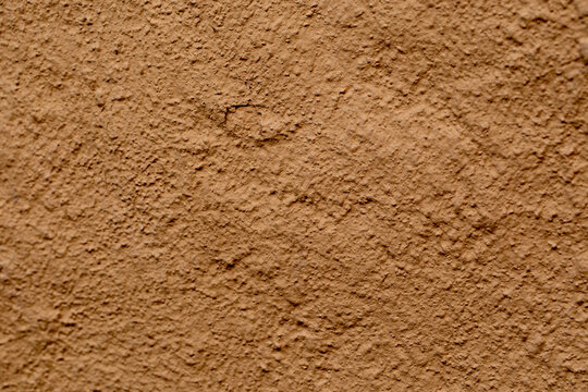 Texture of clay house structure. Wall of soil house. Mud background, 