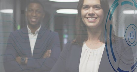 Man wearing smartwatch and woman smiling in data center, overlaying blue tech HUD graphics - Powered by Adobe