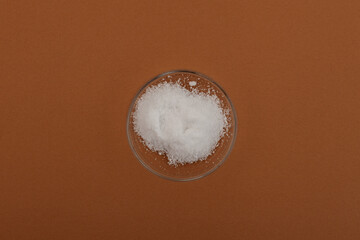 Magnesium sulfate or magnesium sulphate in Petri dish. Food additive E518 used as coagulant for...