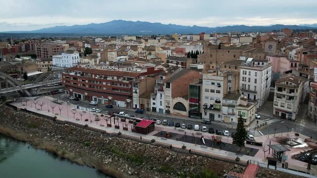 Mora de Ebro aerial view with village, river, and bridge in Catalonia, Spain. High quality 4k footage