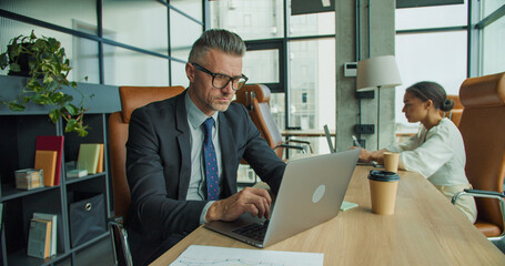 Businesspeople working in modern office space