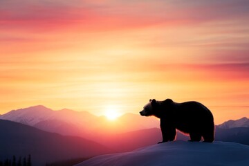 A powerful grizzly bear stands proudly on a mountain peak as the sun sets, its silhouette outlined against vibrant hues of orange and purple