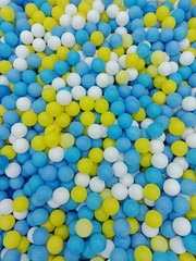 piles of colorful balls on the playground.