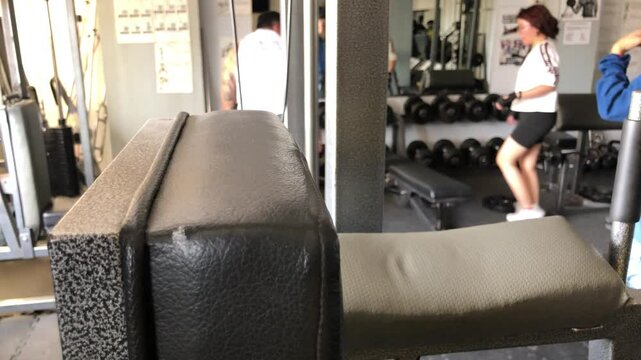 Young people working out inside the gym. Blurs