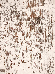 Weathered texture of rustic distressed wall with peeling paint