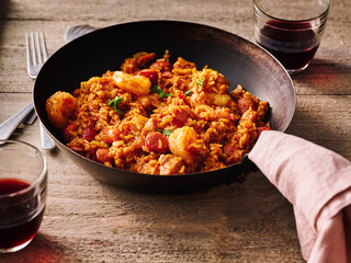 Delicious sausage, shrimp, and rice blend together in a single pot, creating a warm and inviting dish. The vibrant colors and rich flavors make it ideal for family gatherings or casual meals