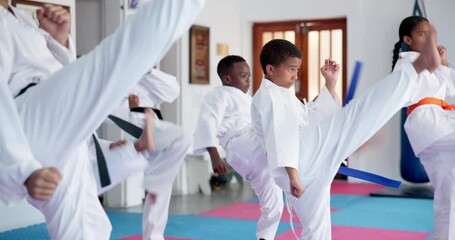Children, karate and group with fighting or kick for self defense training, taekwondo or martial arts. Kids, learning and practice session with punching or technique for kata or lesson in aikido dojo - Powered by Adobe