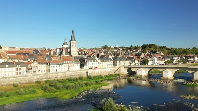 The old center of La Charite facing its bridge in Europe, in France, in Burgundy, in Nievre, in summer, on a sunny day.&nbsp;