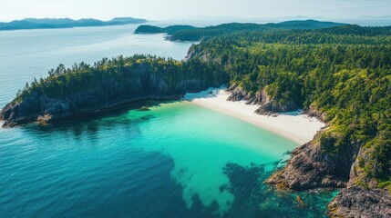 Obraz premium Scenic aerial view of a white sand beach along a rugged, forested coastline with turquoise waters.