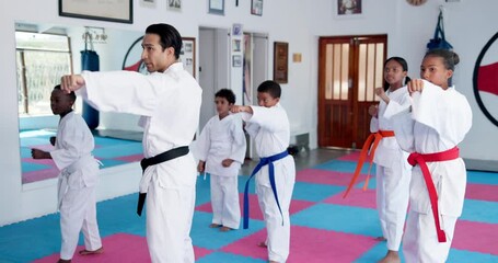 Teaching karate, children and group exercise in dojo for sport, fitness lesson or self defense class. Students, instructor and practice martial arts with man for workout, learning and kids training - Powered by Adobe