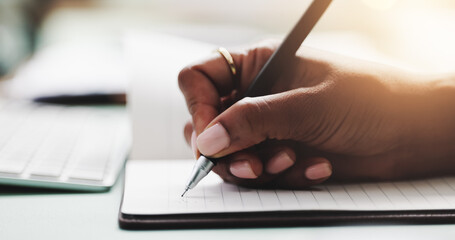 Hand, notebook and writing with business person at desk in office for agenda, planning or schedule....