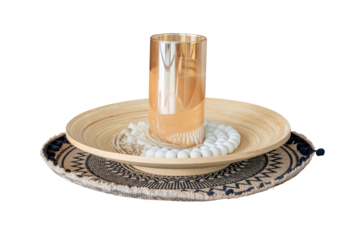 Candle in dark glass bottle on beautiful plate, soft focus, photo on white background, isolated object