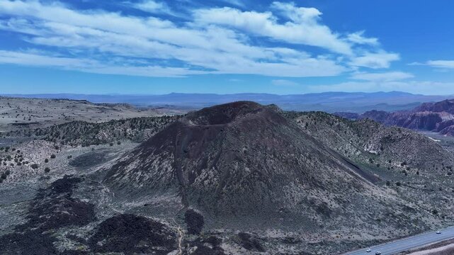 Aerial volcano cinder cone mountain St George Utah circle 1. Southwestern desert mountains landscape. Geological wind, weather and water carved erosion. Hiking trails and nature travel. Environment.