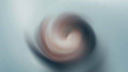 Close up blurred vortex of hair and face against a light blue background creating abstract motion effect
