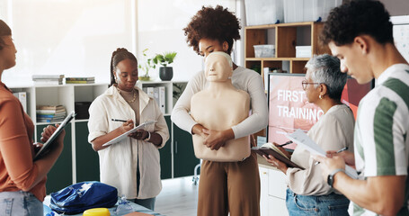 First aid, training and people with choking dummy in office for abdominal thrusts, heimlich...