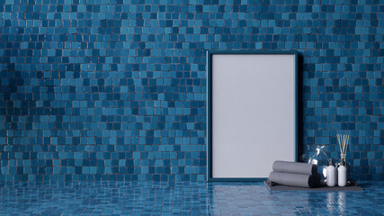 A modern interior featuring a blue tiled wall with a blank frame, towels, and decorative bottles, creating a serene and stylish atmosphere.