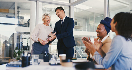 Applause, winner and award with business people in meeting for trophy, achievement and deal. Promotion, congratulations and handshake with group of employees in office for profit, bonus and success