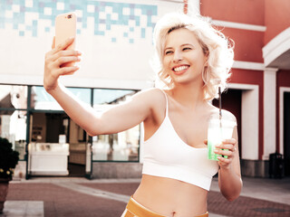 Young beautiful smiling hipster woman in trendy summer clothes. Sexy carefree model posing on the...