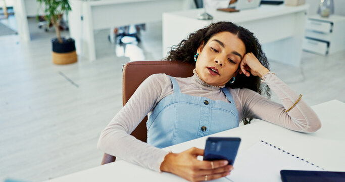 Bored woman, fatigue or phone on office with burnout for stress, insomnia or poor time management. Tired, female person or lazy employee on mobile smartphone in procrastination or sluggish work ethic