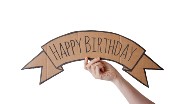 A cardboard banner with the text "HAPPY BIRTHDAY" is being held up by a hand,  isolated on white, transparent background	
 - Powered by Adobe