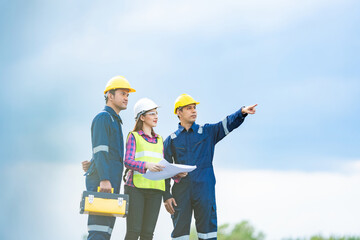 Wind energy projects demand both innovation and precision, and this Asian male and female engineers...