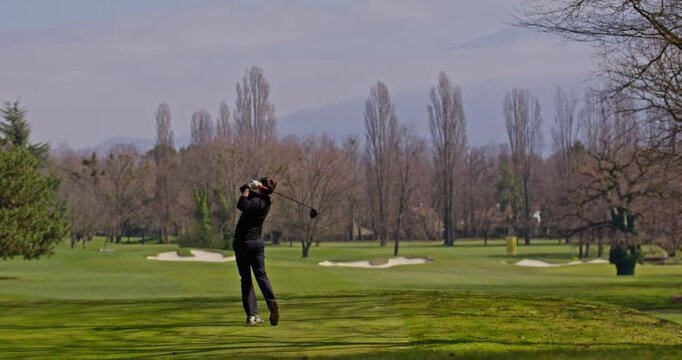 Young golfer playing on a sunny spring day in Switzerland, showcasing precise chipping, putting, bunker, and approach shots. Perfect for sports, lifestyle, and outdoor themes.