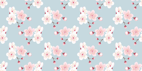 Seamless pattern of sakura flowers and branches on a blue background. Vector illustration.
