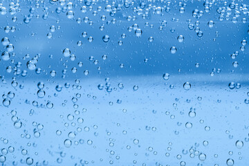 Soda water with bubbles as background, closeup