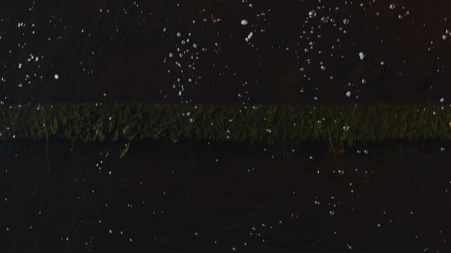 Ballinode, County Monaghan, Ireland, April 2023. Drone flying over cascading water near Ballinode Millwheel, close-up view of river&rsquo;s smooth flow and foamy currents.