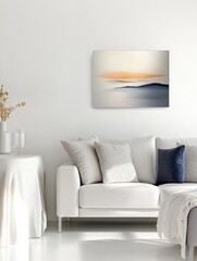 Bright contemporary den seating area showcasing minimal decor and a small painting above the sofa in neutral colors