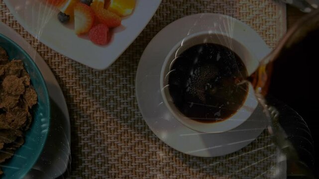 Flat design overhead view showing coffee cup being filled beside teal cereal bowl and fruit plate