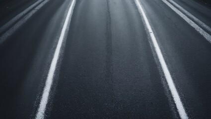 Asphalt road surface with textured markings and lines