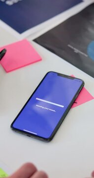 Person, hands or programmer with phone screen for app design, UX or new UI on office desk. Coder, software developer or web designer on mobile smartphone project for user demonstration or AI function