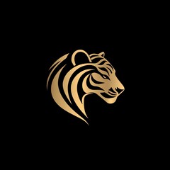 Naklejka premium Majestic Golden Tiger Head, Elegant Design, Black Background. A symbol of power, grace, and wild beauty.