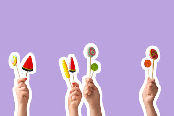 Women holding sweet lollipop on lilac background