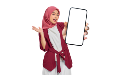 Surprised young Asian Muslim woman with hijab holding smartphone with blank screen isolated on transparent background