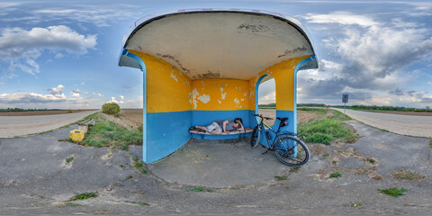 spherical seamless 360 hdri panorama inside empty concrete bus stop painted blue and yellow with...