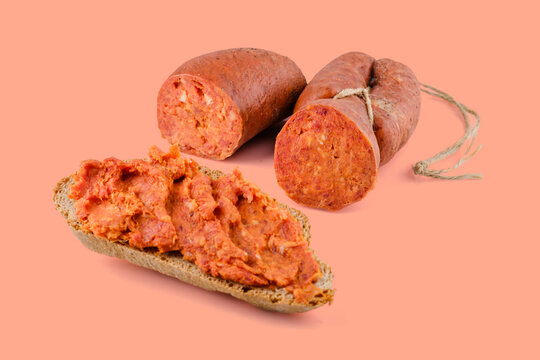 nduja spread on bread slice with two pieces of calabrian salami