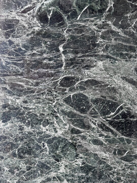 Dark green marble texture with intricate white veins