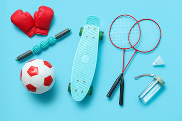Set of sports equipment on blue background, top view © Pixel-Shot